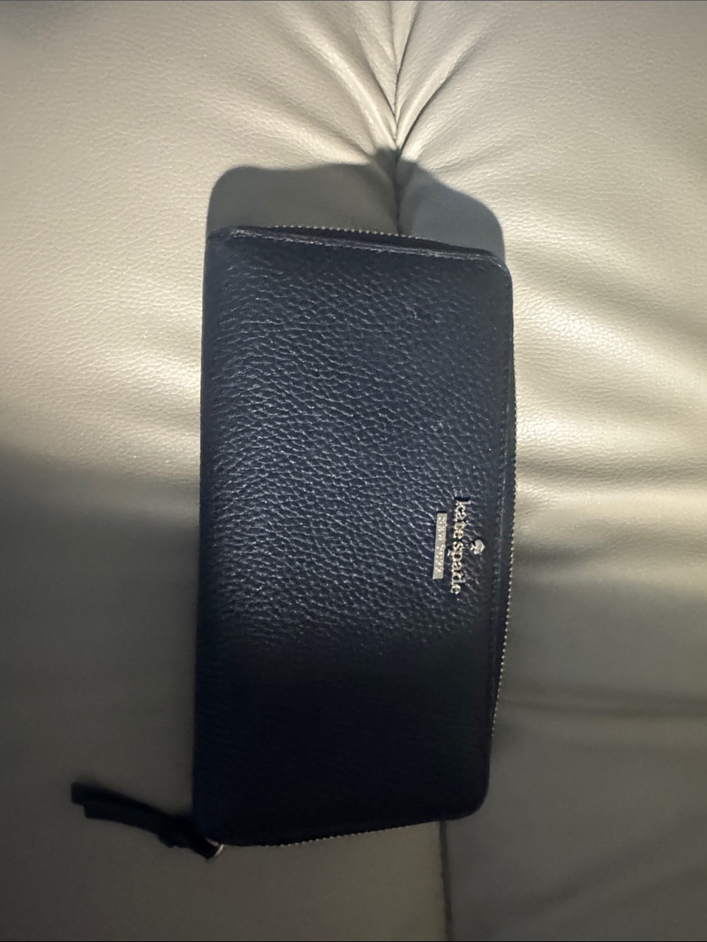 kate spade black pebbled leather zip-around wallet with gold logo
